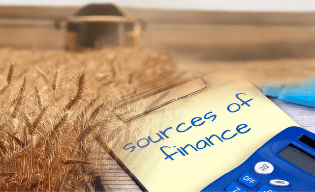 Tractor harvest grains of wheat in a farm field. Original public domain image from Wikimedia Commons